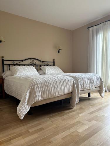 Postel nebo postele na pokoji v ubytování Hotel Cal Martri