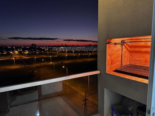 a room with a view of a city at night at Edificio Victoria in Encarnación