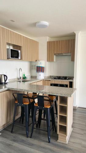 Η κουζίνα ή μικρή κουζίνα στο Moderno departamento con vista única - Iquique