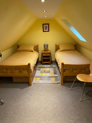 Postel nebo postele na pokoji v ubytování Springwell Cottage