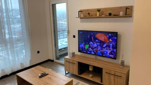 AAvenue Homeにあるテレビまたはエンターテインメントセンター