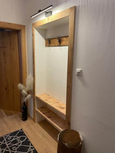 a dressing room with a mirror on the wall at The Dolomiti View in Debant