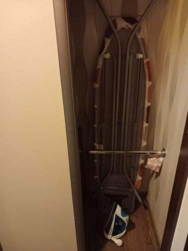 a closet with a rack with shoes in it at Apartament Lena in Suwałki
