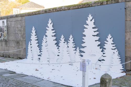 a mural of christmas trees on a wall at Casa Luna Rural Con Piscina y Jardín in Ourense