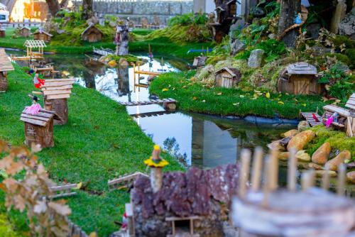 a miniature model of a river with houses and boats at Casa Luna Rural Con Piscina y Jardín in Ourense