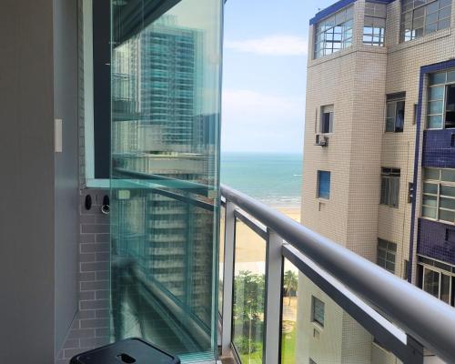 a balcony with a view of the ocean at Book Santos Unlimited 1216 - Vista Lateral do Mar in Santos