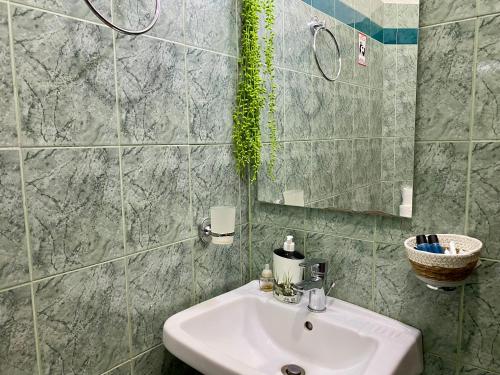 Koupelna v ubytování Hotel Metali