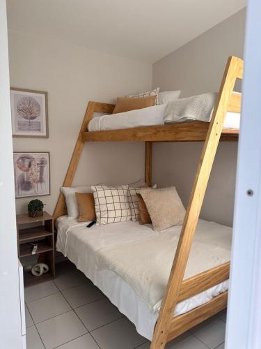 two bunk beds in a small room at Elegant Modern Tiny Home in San Miguel