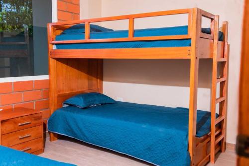 Giường trong phòng chung tại QUINTAPiedad