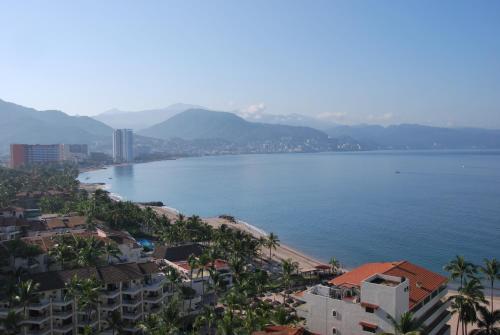 a view of the ocean from a city at Beachfront view Condo beside la Isla Mall in Puerto Vallarta