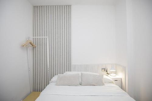 Postel nebo postele na pokoji v ubytování Apartamento con gran terraza en Girona
