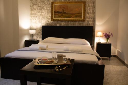 Una cama o camas en una habitación de Noradia and Ginfred villas Corfu