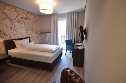 Ένα ή περισσότερα κρεβάτια σε δωμάτιο στο Anders Hotel & Tagungen