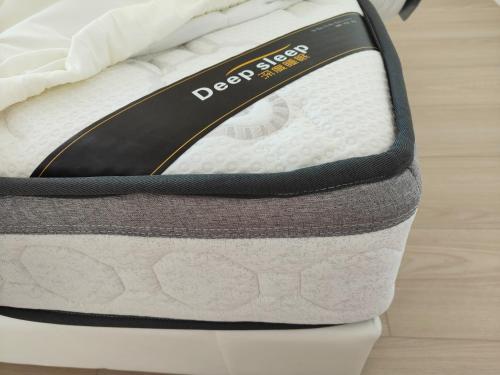 a close up of a mattress on a bed at Orewa New house with view on deck near Cafe,bush & river in Orewa