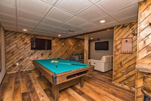 a pool table in a room with wooden walls at Camelback Ski Mts,Firepit, Hottub,Kalahari WaterPark,Linens! in Cresco