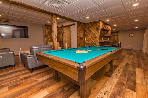 a billiard room with a pool table in it at Camelback Ski Mts,Firepit, Hottub,Kalahari WaterPark,Linens! in Cresco