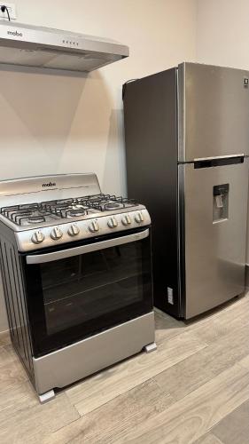 Η κουζίνα ή μικρή κουζίνα στο Suite en exclusivo residencial privado
