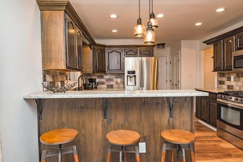a kitchen with wooden counter tops and wooden stools at Camelback Ski Mts,Firepit, Hottub,Kalahari WaterPark,Linens! in Cresco