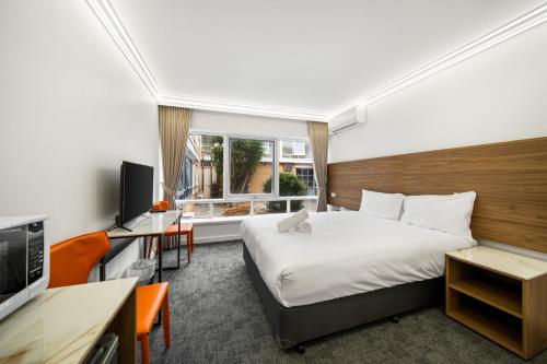 Postel nebo postele na pokoji v ubytování Kingsway Motel Geelong