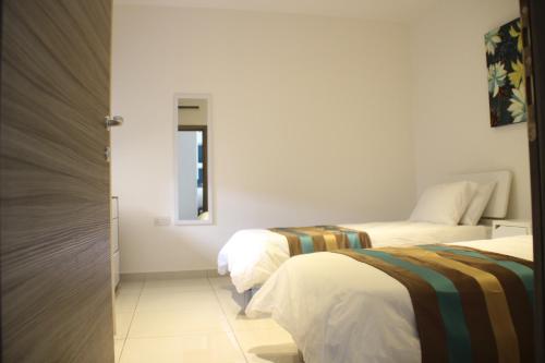 Cama o camas de una habitación en Lampuka Apartments