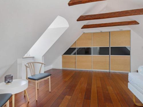 a living room with a couch and a table at Spacious Retreat in Lokken - By Traum Ferienwohnungen in Løkken