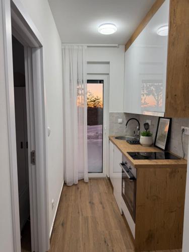 a kitchen with a sink and a counter top at Divčibarski pogledi in Divčibare