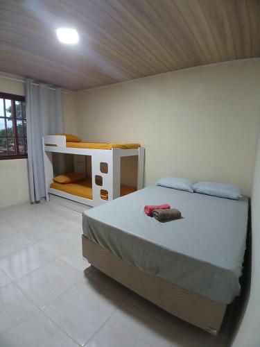 Katil atau katil-katil dalam bilik di Rosemary Hospedagem
