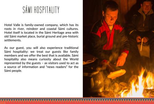 a picture of a man cooking food over a fire at Hotel Valle Lapland in Utsjoki
