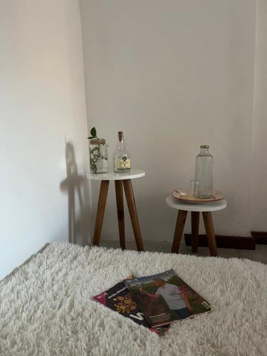 a bedroom with two tables with at ReMar na Barra, ENSEADA DO PORTO in Salvador