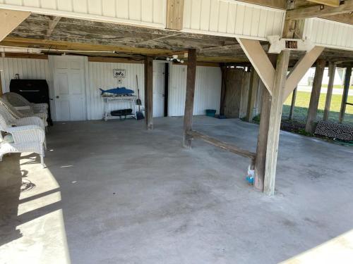 a large empty garage with a building with at A Drunken Parrots Beach Side Paradise in North Topsail Beach