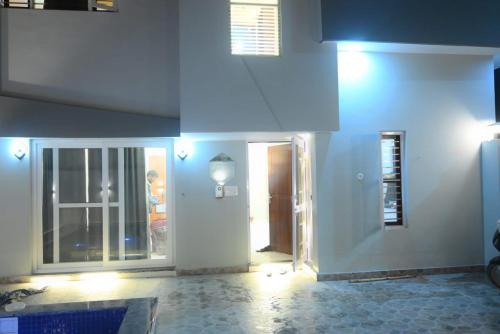 a hallway of a house with a door and a room at Your Place - The Pool Villa in Roorkee