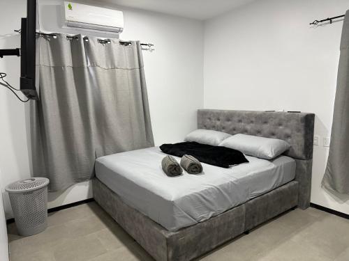 Katil atau katil-katil dalam bilik di Mami Apartments