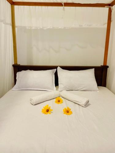 Postel nebo postele na pokoji v ubytování White Hill House Hiriketiya