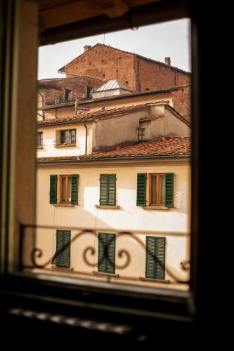 a view of a building from a window at Appartamento Il Glicine in Pistoia