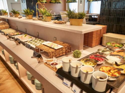 a buffet line with many different types of food at Kansai Airport Washington Hotel in Izumi-Sano