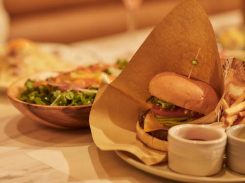 a sandwich and a salad and a bowl of fries at Kansai Airport Washington Hotel in Izumi-Sano