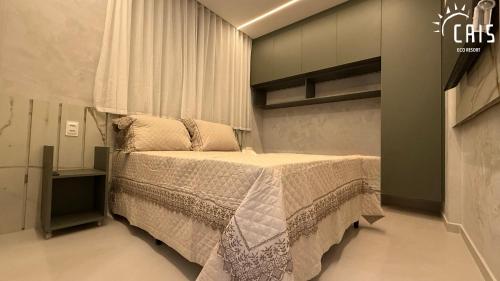 a bedroom with a large bed in a room at Cais Eco Resort in Porto De Galinhas