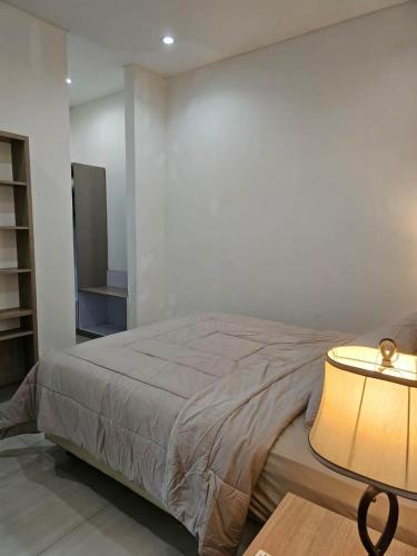 Ένα ή περισσότερα κρεβάτια σε δωμάτιο στο Atma Karsa House
