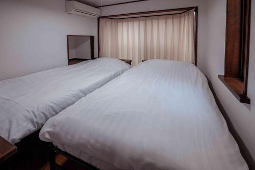 Postel nebo postele na pokoji v ubytování Home Stay COCCHI