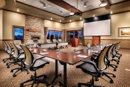 a conference room with a large table and chairs at Flying Horse Resort & Club in Colorado Springs