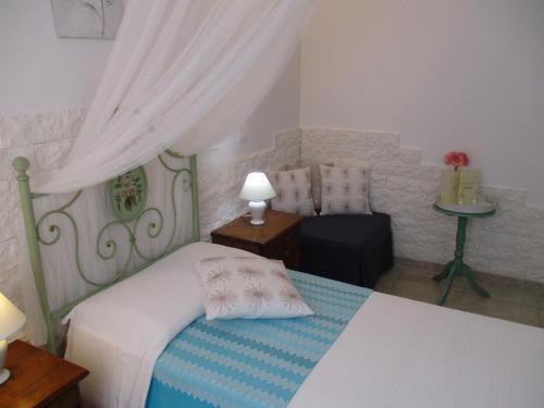 Postel nebo postele na pokoji v ubytování Villa Margherita Suite & charme