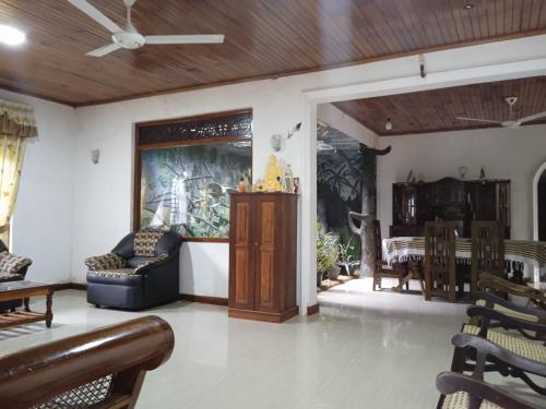 a living room with a couch and a table at Brickhaven Villa in Dodanduwa