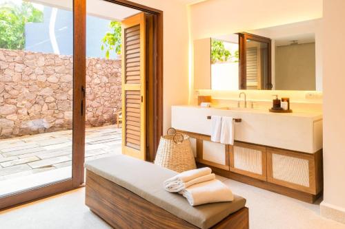 a bathroom with a sink and a mirror at El Careyes Club & Residences in Careyes