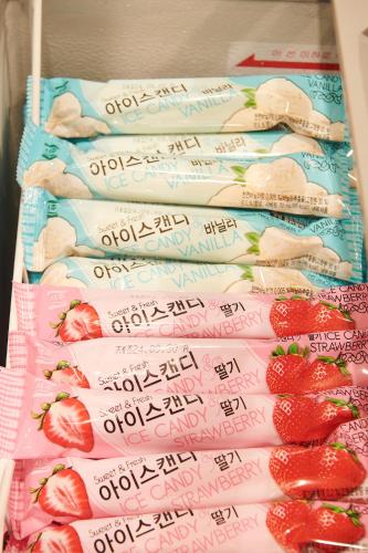 a bunch of signs with strawberries on them at Dormy Inn EXPRESS SEOUL Insadong in Seoul