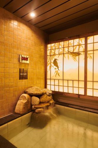a room with a pool of water and a window at Dormy Inn EXPRESS SEOUL Insadong in Seoul