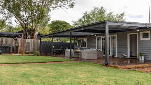 a pergola on a deck in a yard at Grenville Belle Daylesford in Daylesford