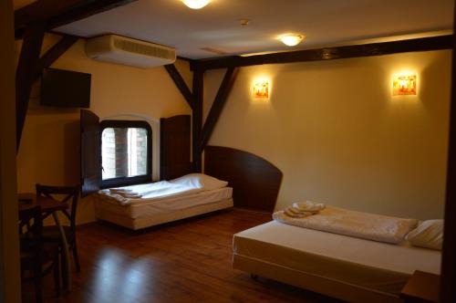 מיטה או מיטות בחדר ב-Centrum Browar