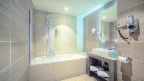 Kylpyhuone majoituspaikassa Hotel Lido **** Mons Centre