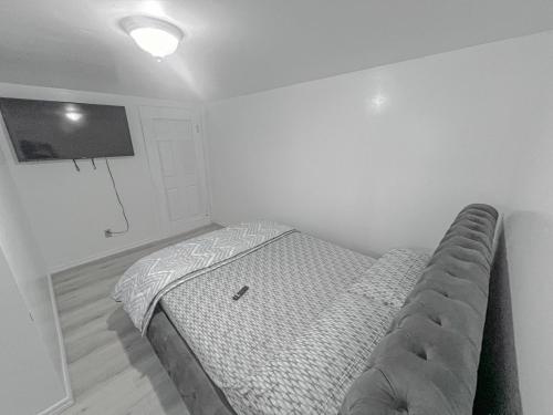a small bedroom with a bed in the corner at Private Room Near Airport D6 in Brampton