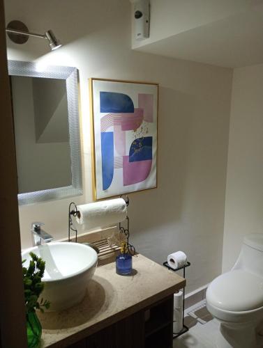 a bathroom with a sink and a toilet at Casa con casa club en la Paz BCS in La Paz